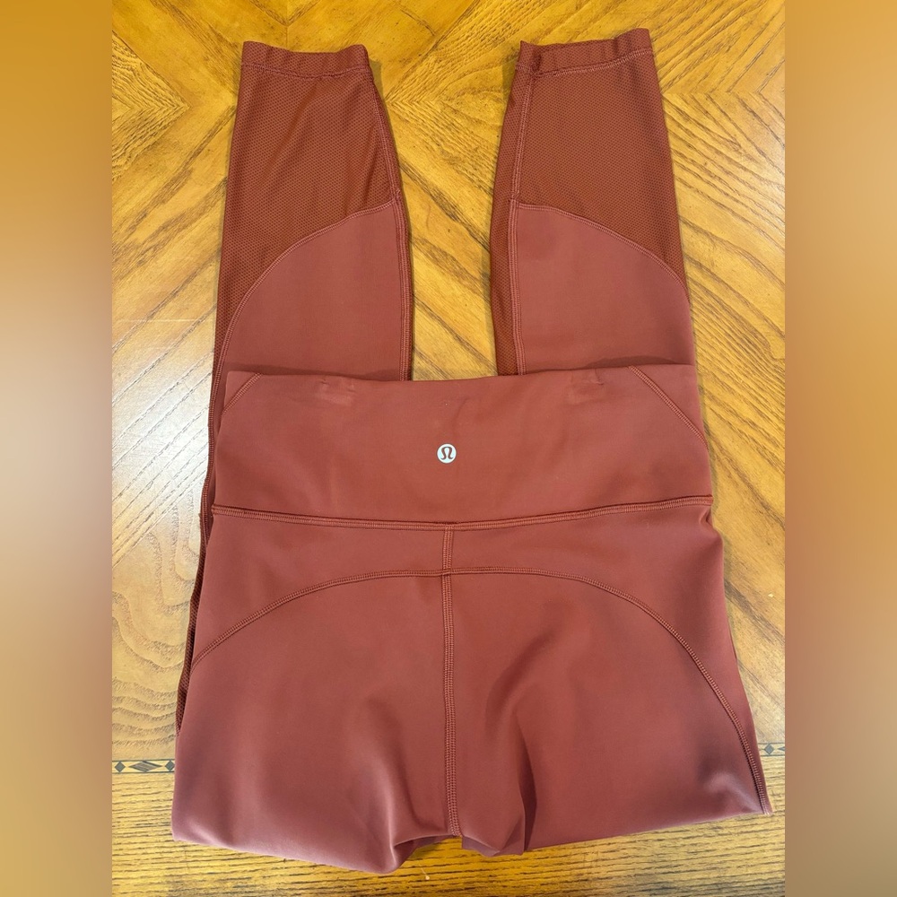 Lululemon high rise tight leggings rust color with mesh at bottom